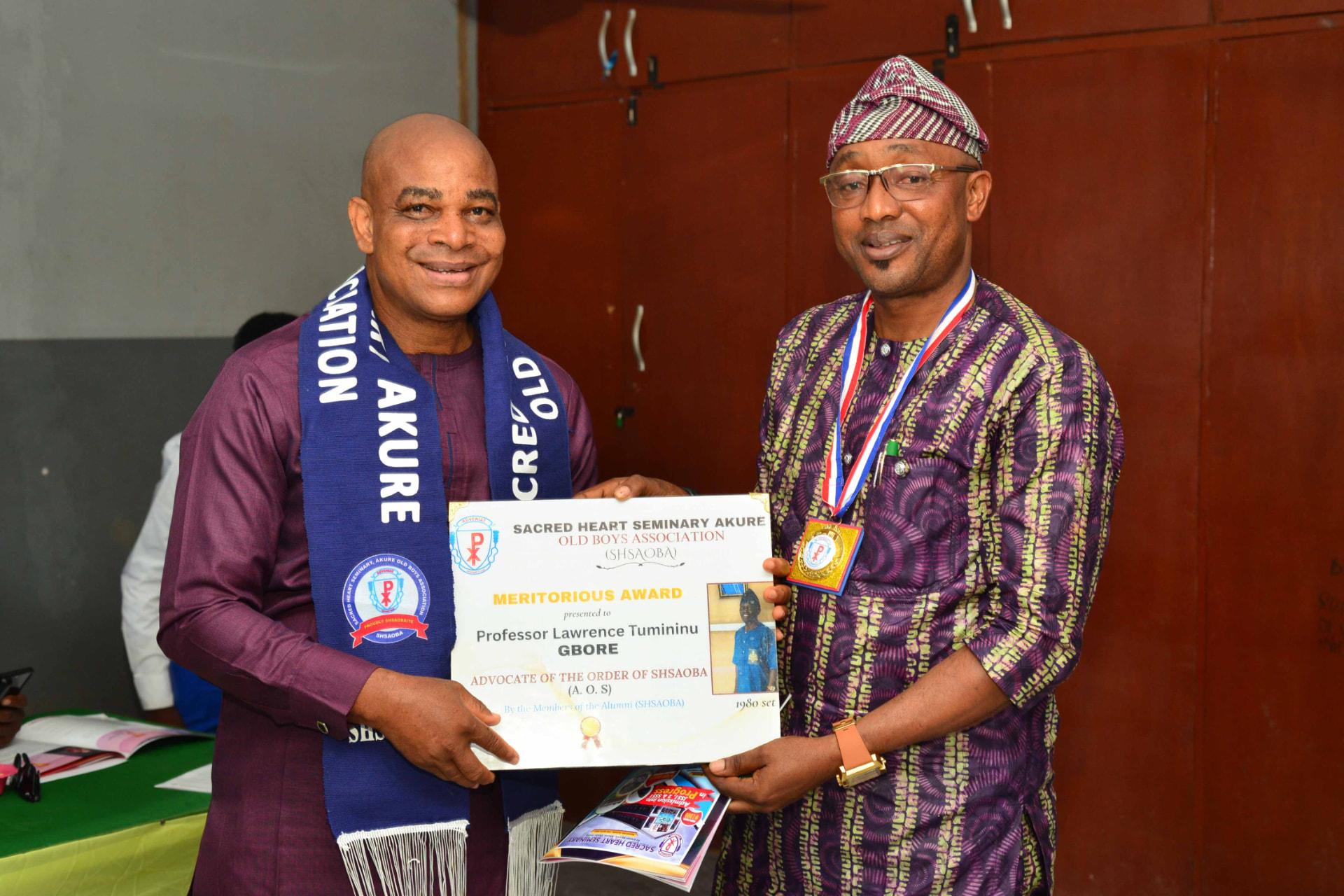 Professor Lawrence Tumininu Gbore receiving his Meritorious Award certificate
