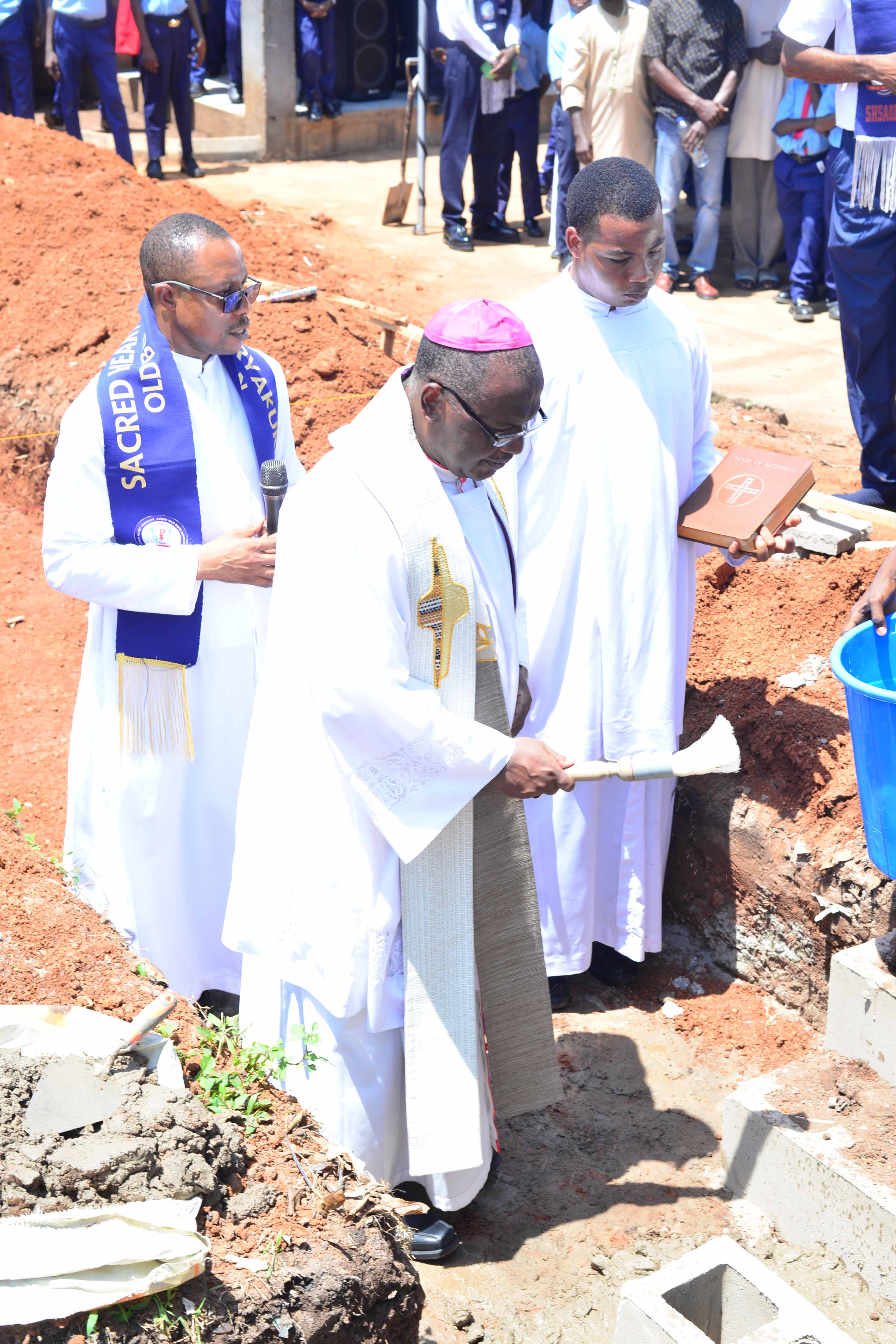Alumni and clergy in prayer